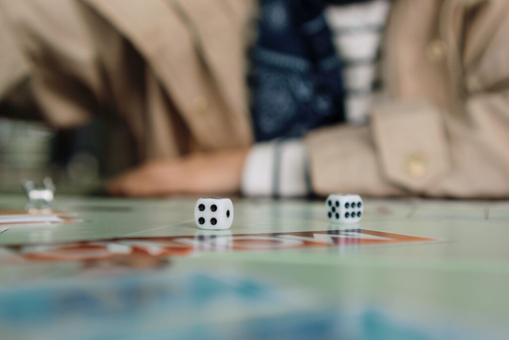 Close up of dice on a board game table, perfect for low pressure fun ideas.