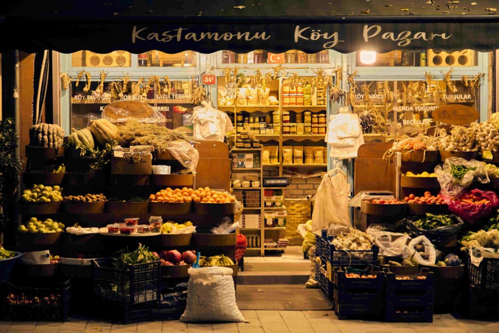An international market storefront filled with fresh produce for unique couple activities.