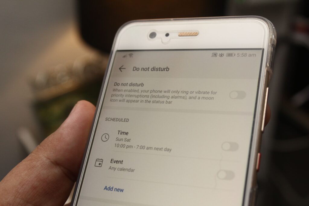 Close up of a phone screen on do not disturb mode, showing a slow fade from false friends.