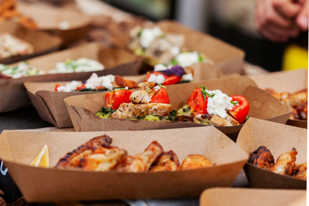An international market stall stocked with colorful bags of food, perfect for shared experiences.